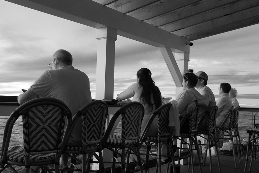 Infrared Photo of Bar with Patrons Watching the Scenery.
